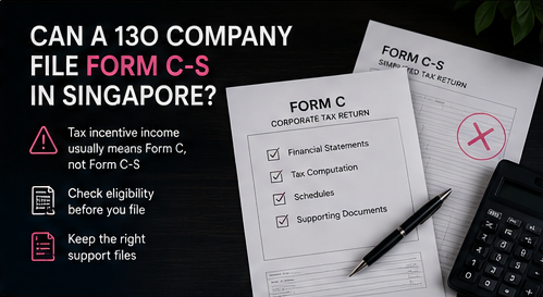 Form C and Form C-S tax return forms with checklist, pen and calculator on dark desk
